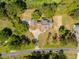 A bird's-eye view showcases a meticulously landscaped property with a circular driveway and sprawling lawn at 3324 Westphal Dr, Johns Island, SC 29455