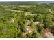 Wide aerial view of a home nestled in a wooded area, showcasing its secluded location at 3324 Westphal Dr, Johns Island, SC 29455