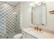 Light bathroom with shower showcases a unique grey tile inside at 3324 Westphal Dr, Johns Island, SC 29455