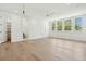 Large bedroom with multiple windows and light hardwood floors, filled with natural light at 3324 Westphal Dr, Johns Island, SC 29455