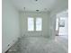 Bright bedroom with white walls, wood trim, and two windows at 3324 Westphal Dr, Johns Island, SC 29455