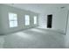 Spacious bedroom with three large windows and an attached bathroom at 3324 Westphal Dr, Johns Island, SC 29455