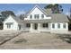 Two story white farmhouse with gray roof and a large front porch at 3324 Westphal Dr, Johns Island, SC 29455