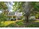 Beautiful home exterior is framed by mature trees and features a welcoming front porch at 3324 Westphal Dr, Johns Island, SC 29455