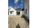 White farmhouse with carport and landscaping at 3324 Westphal Dr, Johns Island, SC 29455
