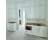 White kitchen cabinets and countertops under construction at 3324 Westphal Dr, Johns Island, SC 29455