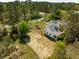 Aerial view of a home's side exterior with a large yard and tree coverage at 3324 Westphal Dr, Johns Island, SC 29455