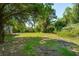 Expansive lot is surrounded by lush greenery with mature trees and a well-maintained lawn at 3324 Westphal Dr, Johns Island, SC 29455