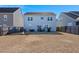 Large backyard with firepit, patio, and privacy fence at 346 Bradley Bend Drive, Moncks Corner, SC 29461