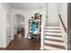 Bright entryway with hardwood floors, coat rack, and stairs leading upstairs at 346 Bradley Bend Drive, Moncks Corner, SC 29461