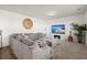 Living room with sectional sofa, electric fireplace, and large TV at 346 Bradley Bend Drive, Moncks Corner, SC 29461