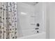 Clean bathroom with tub shower combo and patterned curtain at 4587 Summey St, North Charleston, SC 29405