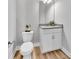 Modern powder room with white vanity and granite top at 4587 Summey St, North Charleston, SC 29405