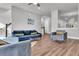 Open living area with hardwood floors and a view to kitchen at 4587 Summey St, North Charleston, SC 29405