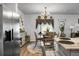 Dining area featuring a round table, stylish chandelier, and stainless steel refrigerator at 474 Camellia Bloom Dr, Moncks Corner, SC 29461