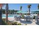 Enjoy the expansive pool area with tables, chairs and umbrellas at 508 Rustling Tree Ct, Summerville, SC 29486