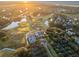 Aerial view of golf course, neighborhood, and marsh at sunset at 515 Claret Way, Kiawah Island, SC 29455