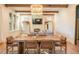 Rustic farmhouse dining room with large wooden table and leather chairs at 515 Claret Way, Kiawah Island, SC 29455