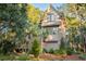 Tan house with mature trees and landscaping at 515 Claret Way, Kiawah Island, SC 29455