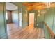 Upper hallway with green walls and wood floors at 515 Claret Way, Kiawah Island, SC 29455