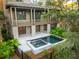 Elevated view of a pool and spa with patio and landscaping at 515 Claret Way, Kiawah Island, SC 29455