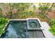 Dark-colored pool and spa with surrounding patio and landscaping at 515 Claret Way, Kiawah Island, SC 29455