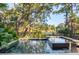 Inviting pool and spa surrounded by lush landscaping at 515 Claret Way, Kiawah Island, SC 29455