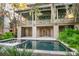 Spacious pool and spa with large patio and tropical landscaping at 515 Claret Way, Kiawah Island, SC 29455
