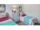 Well-lit bedroom featuring twin beds, dresser, and artwork at 519 Parkdale Dr # J, Charleston, SC 29414