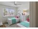 Bright bedroom with twin beds, dresser, and window views at 519 Parkdale Dr # J, Charleston, SC 29414