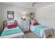 Charming bedroom with twin beds, a dresser, and colorful decor at 519 Parkdale Dr # J, Charleston, SC 29414
