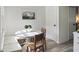 Cozy breakfast nook with round table, chairs, and built-in bench at 519 Parkdale Dr # J, Charleston, SC 29414