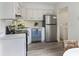 Updated kitchen featuring stainless steel appliances and white cabinets at 519 Parkdale Dr # J, Charleston, SC 29414