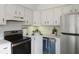 Efficient kitchen with stainless steel appliances and white cabinets at 519 Parkdale Dr # J, Charleston, SC 29414