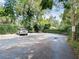 Private parking lot with lush landscaping providing convenient parking at 53 Hasell Street St # H, Charleston, SC 29401