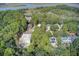 Aerial view of neighborhood with lush trees at 615 W Beach Ct, Folly Beach, SC 29439