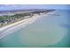 Beachfront aerial view showing ocean, beach, and coastal town at 615 W Beach Ct, Folly Beach, SC 29439
