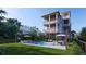 Gorgeous multi-story home with a relaxing pool area, complete with lounge seating and outdoor dining at 615 W Beach Ct, Folly Beach, SC 29439