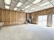 Finished basement with wood paneling, sliding doors, and carpet at 8025 Eberly Ave, North Charleston, SC 29420