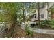 Stone pathway leads to a cozy patio area in the backyard at 8604 Fox Hollow Rd, North Charleston, SC 29420
