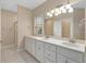 Bathroom boasts double vanity, tile flooring, and shower at 8604 Fox Hollow Rd, North Charleston, SC 29420