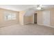 Simple bedroom with beige walls, ceiling fan, and neutral carpet at 8604 Fox Hollow Rd, North Charleston, SC 29420