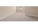 Simple bedroom with window and neutral carpet at 8604 Fox Hollow Rd, North Charleston, SC 29420