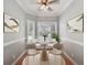 Bright dining room with hardwood floors and window seating at 8604 Fox Hollow Rd, North Charleston, SC 29420