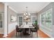 Formal dining room with hardwood floors and chandelier at 8604 Fox Hollow Rd, North Charleston, SC 29420