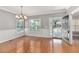 Elegant dining room with hardwood floors, chandelier, and built-in shelving at 8604 Fox Hollow Rd, North Charleston, SC 29420