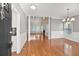 Grand entryway with hardwood floors, columns, and views to living room and dining room at 8604 Fox Hollow Rd, North Charleston, SC 29420