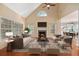 Gathering room with hardwood floors, fireplace, and ample natural light at 8604 Fox Hollow Rd, North Charleston, SC 29420