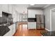 Eat-in kitchen with white cabinets, granite counters, and stainless steel appliances at 8604 Fox Hollow Rd, North Charleston, SC 29420