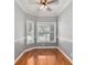 Bright office features hardwood floors, bay window, and ceiling fan at 8604 Fox Hollow Rd, North Charleston, SC 29420